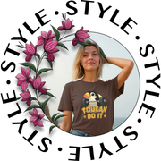 A woman poses confidently in a “Toucan Do It” t-shirt featuring a toucan with dumbbells. Floral border and repeated word
