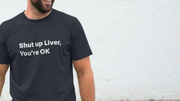 A man wearing a navy slogan T-shirt with the humorous text