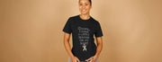 A Woman in a black Funny T-shirt with playful text,