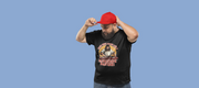 Man in a black funny T-shirt with a DJ Jesus design and text