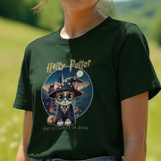 Woman wearing a green geek T-shirt featuring a cat dressed as a wizard with glasses, holding a wand. Text reads