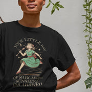 A Woman in a black Retro T-shirt features a vintage-style design of a woman holding a spoon with the text