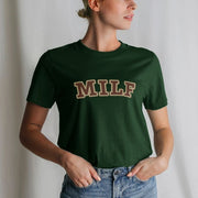 A Woman wearing a dark green Hen T-shirt with the letters