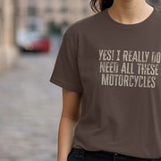 A Woman wears a brown Motorcycle T-shirt with bold text reading,
