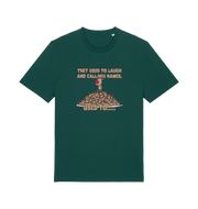 green christmas t-shirt with the graphic of rudolph stood on tp of a pile of reindeer and the slogan 'they used to call him names used to...'