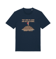 navy christmas t-shirt with the graphic of rudolph stood on tp of a pile of reindeer and the slogan 'they used to call him names used to...'