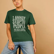 A Woman in a relaxed pose wears a green Sarcastic T-shirt with bold white text saying, 