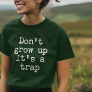 Woman wearing a navy Womans Slogan hoodie with the text 