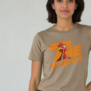 A Woman wearing a beige Christmas T-shirt with an orange graphic of a surprised cartoon turkey and the text 