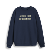 navy christmas sweater with the slogan 'alcohol first then relatives'