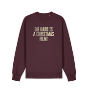 red brown christmas jumper with the slogan 'die hard is a christmas film'