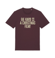 red brown christmas t-shirt with the slogan 'die hard is a christmas film'