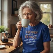 Woman drinking coffee wearing a blue t-shirt with a humorous coffee-themed message.