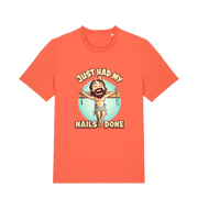 orange funny jesus t-shirt with the graphic of a cartoon jesus on the cross and the slogan 'just had my nails done'