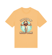 yellow funny jesus t-shirt with the graphic of a cartoon jesus on the cross and the slogan 'just had my nails done'