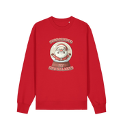 red christmas sweater with the graphic of santa in a snowglobe and the slogan 'surrounded by snowflakes'