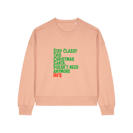 peach christmas sweater with the slogan 'stay classy this christmas santa doesn't need anymore ho's'
