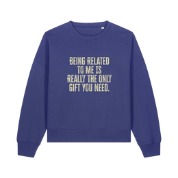 blue christmas sweater with the slogan 'being related to me is really the only gift you need'